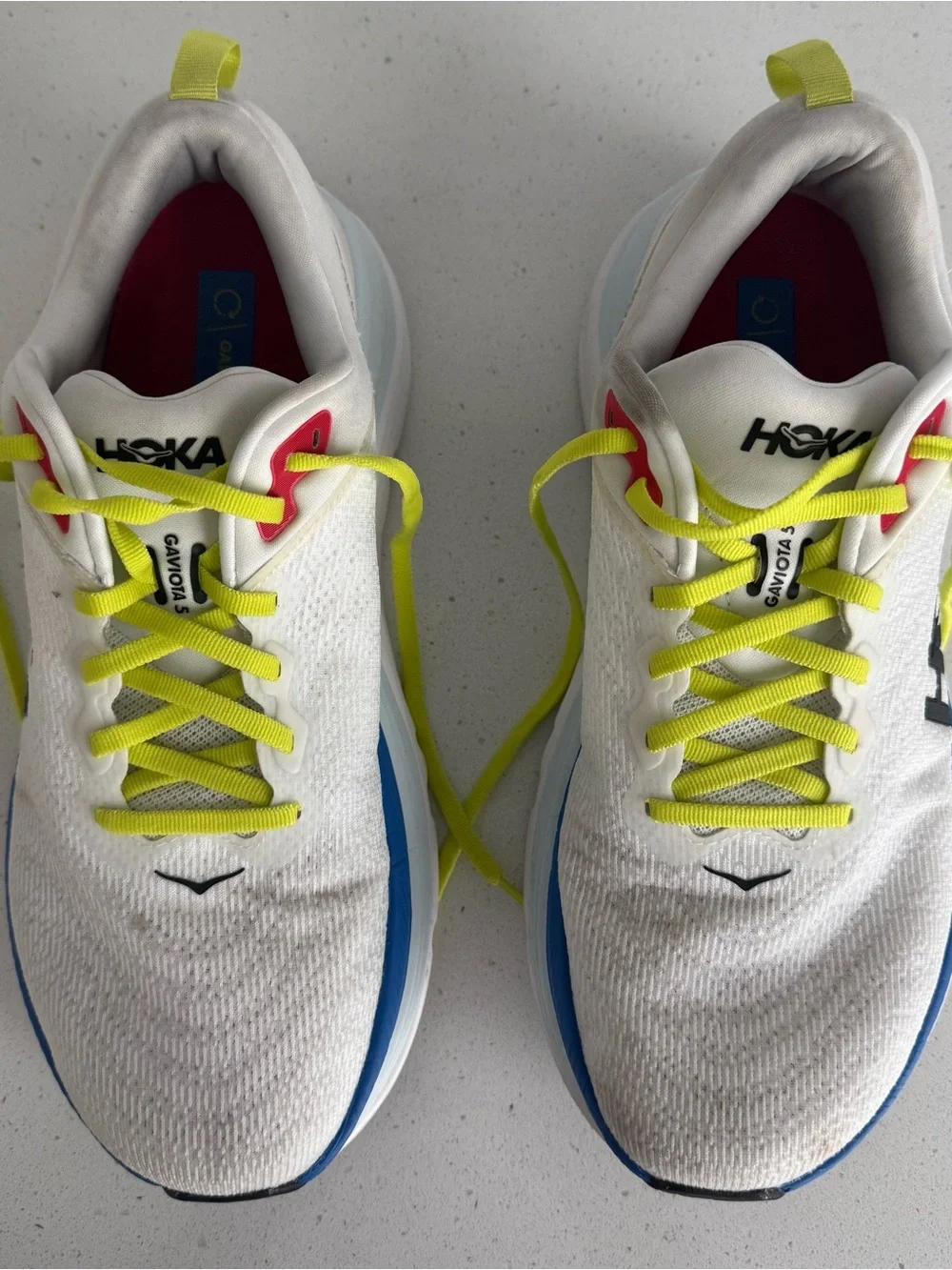 Hoka White Running Shoes with Neon Yellow Laces and Blue Accents